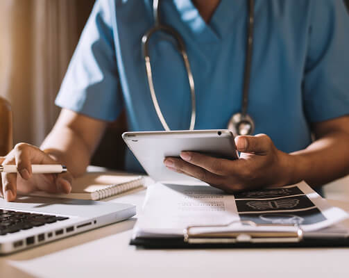 doctor using a calculator