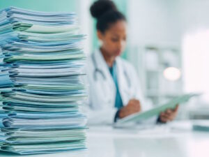 Doctor reviewing QME reports for MMI